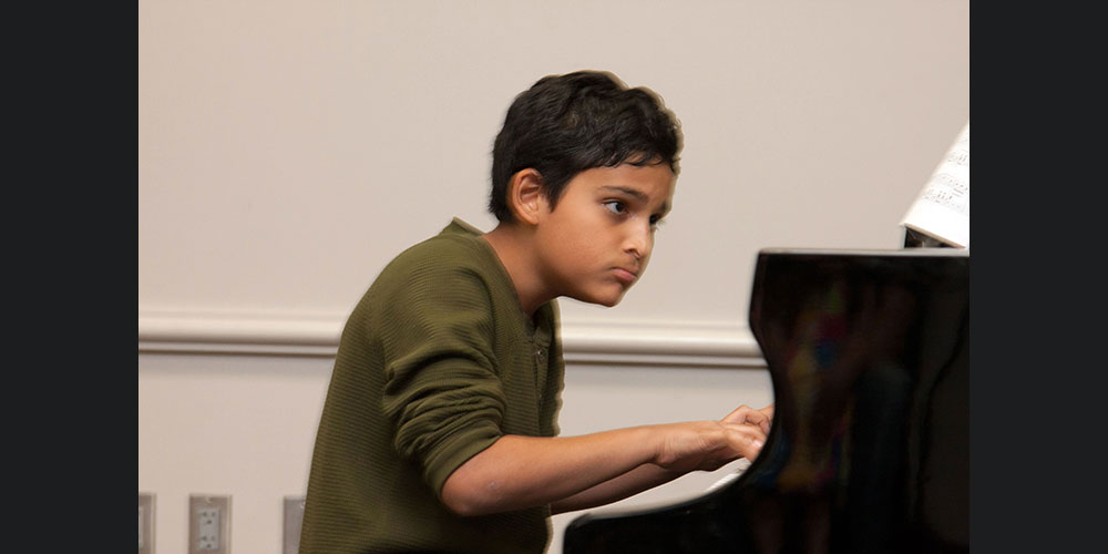 Ishan plays piano